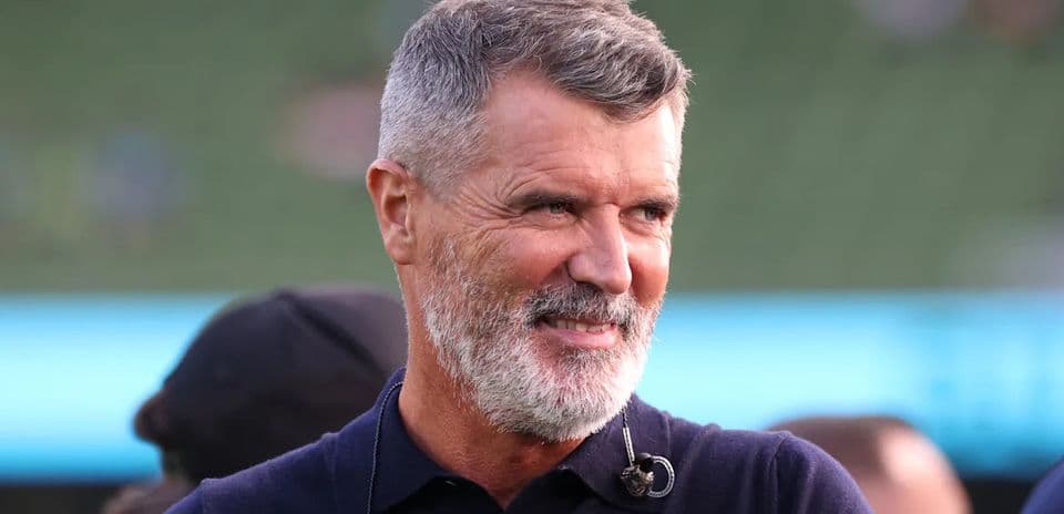 Man with gray beard smiling at event