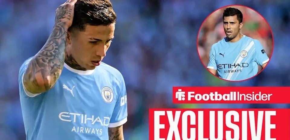 Player looking down in Manchester City kit