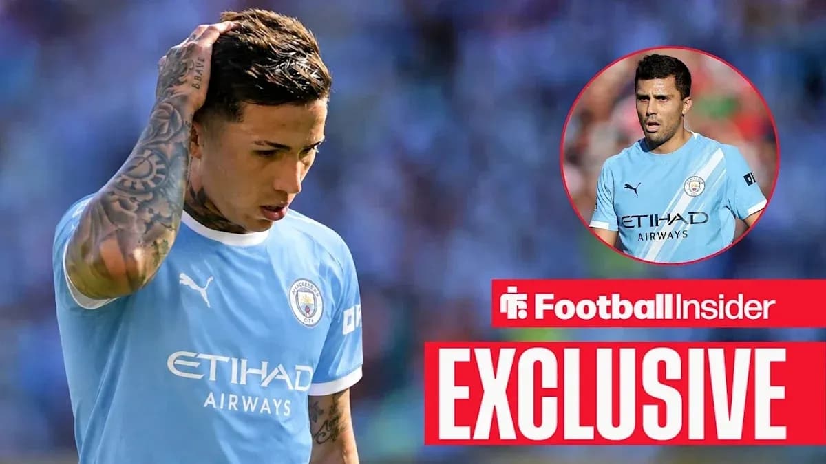 Player looking down in Manchester City kit