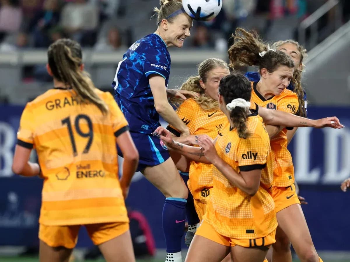 Players competing for the ball during match