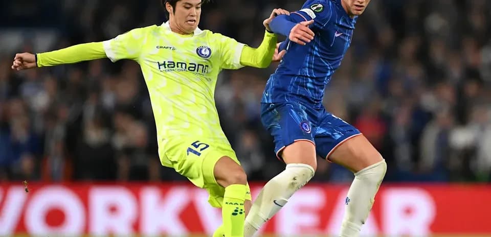 Two players contesting the ball during a match