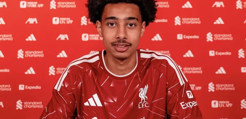 Player signing contract at Liverpool FC announcement