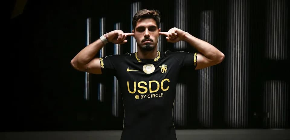Player wearing black jersey with USDC logo
