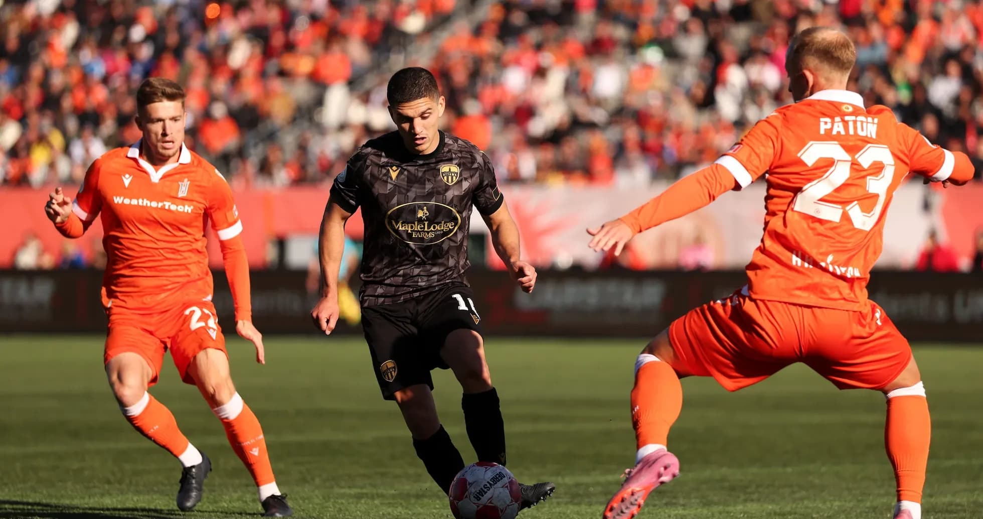 Players competing for the ball in match