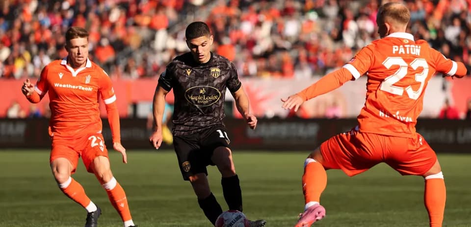 Players competing for the ball in match