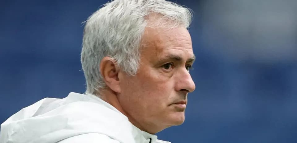 Coach with gray hair during a match