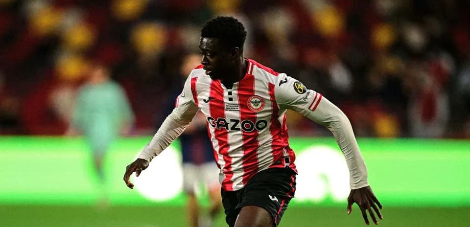 Brentford player running on the pitch during match