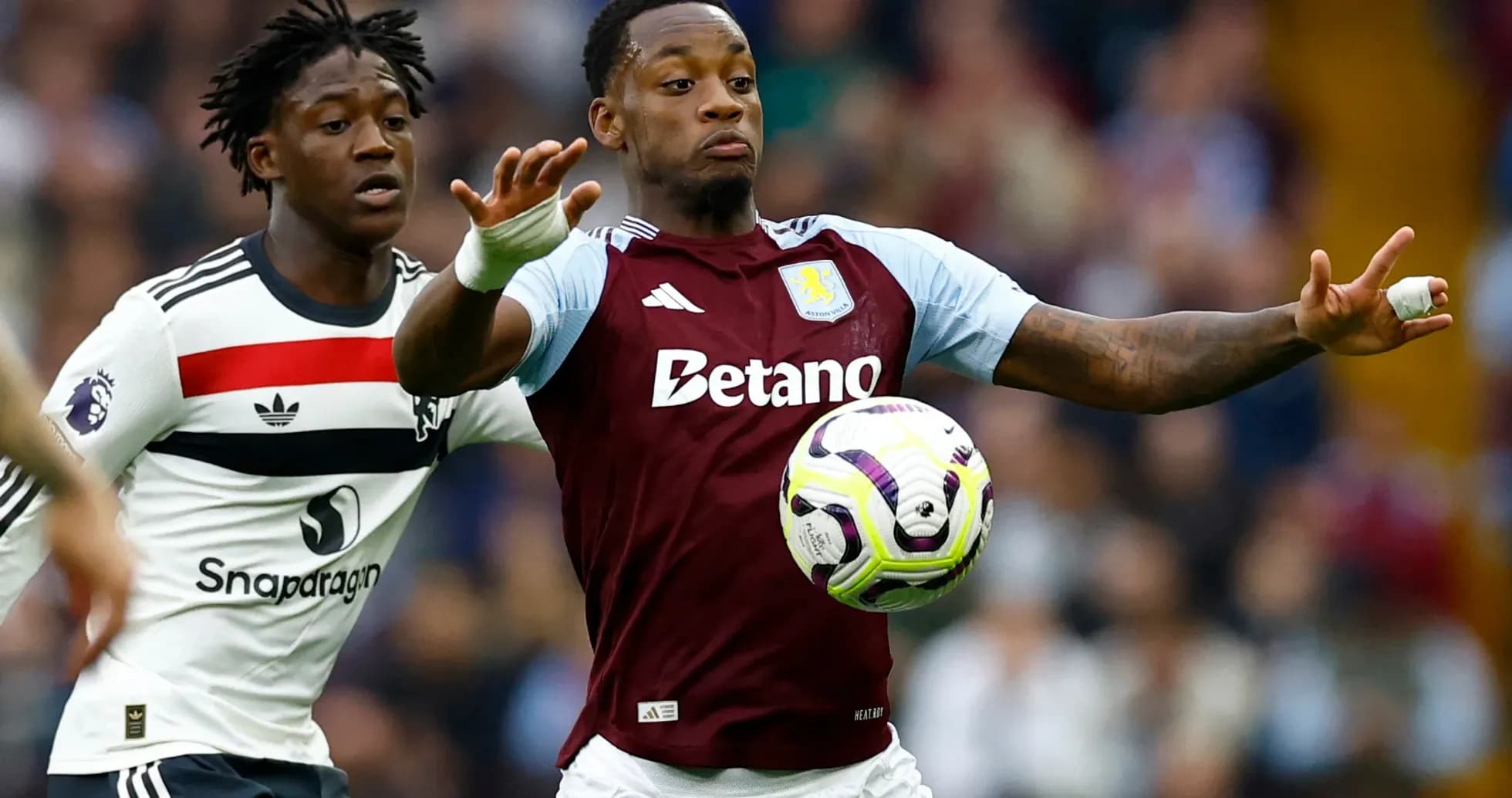 Aston Villa player controlling the ball during match