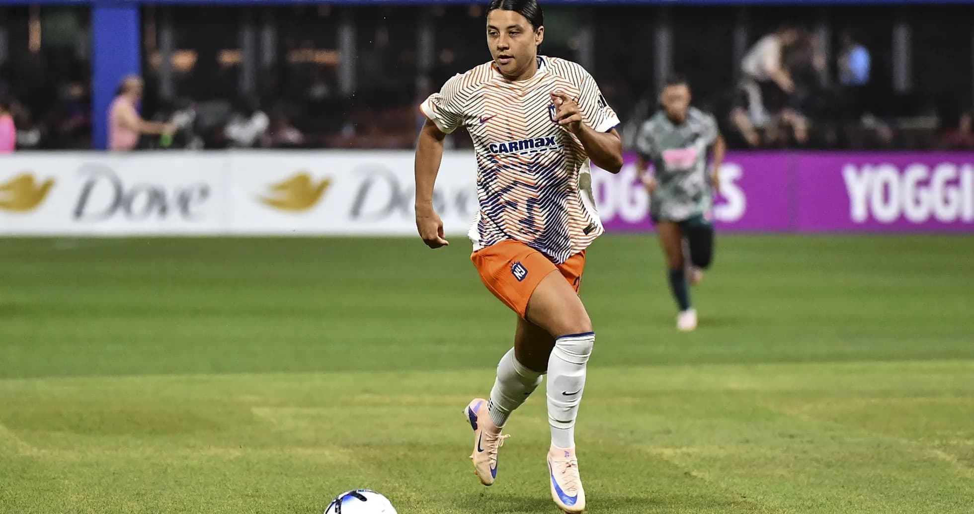 Player running with the ball during a match