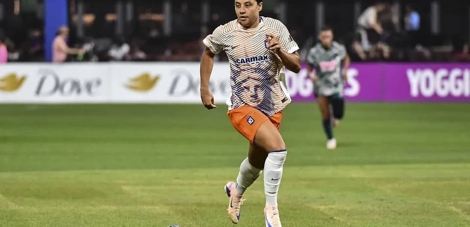 Player running with the ball during a match