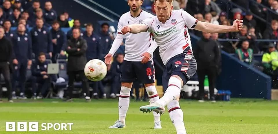 Player taking a penalty kick during a match