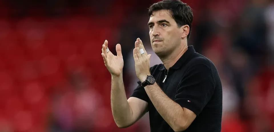 Coach gesturing with hands during match