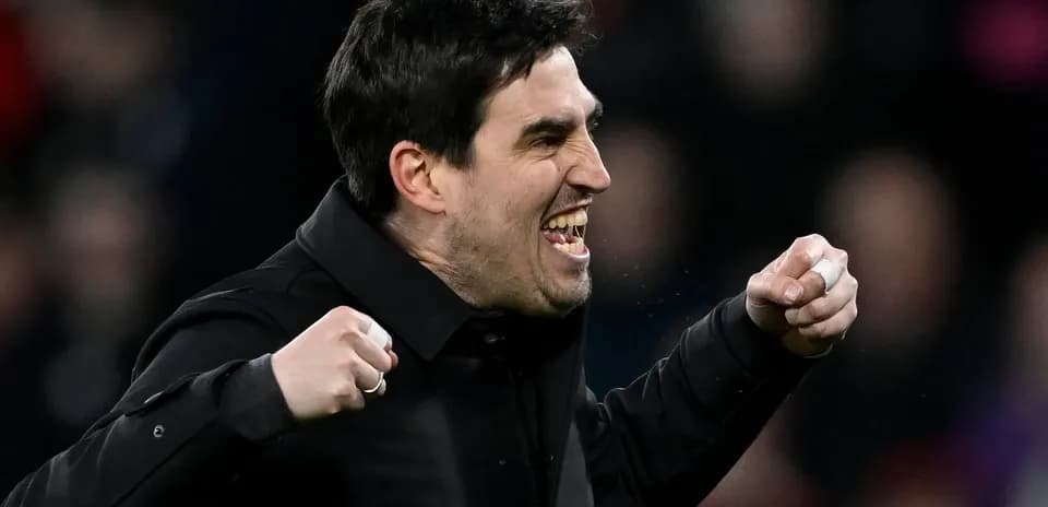Coach celebrating a victory with clenched fists
