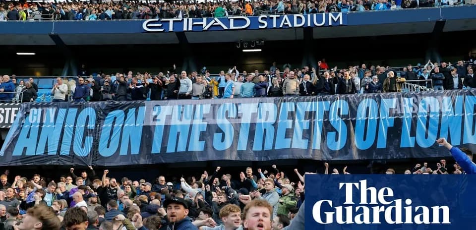 Fans celebrating with banner at Etihad Stadium