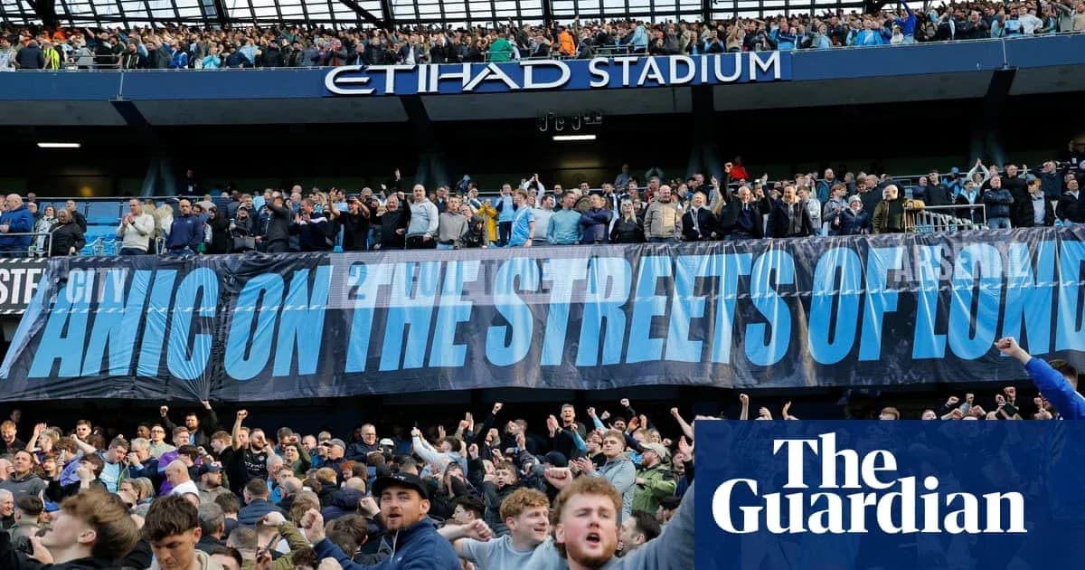 Fans celebrating with banner at Etihad Stadium