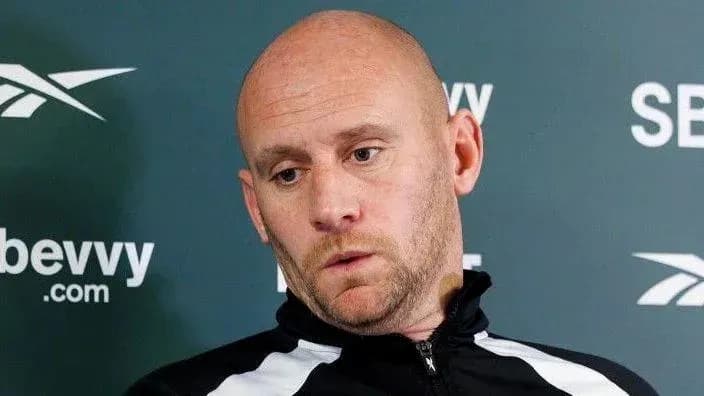 Man in sportswear during a press conference