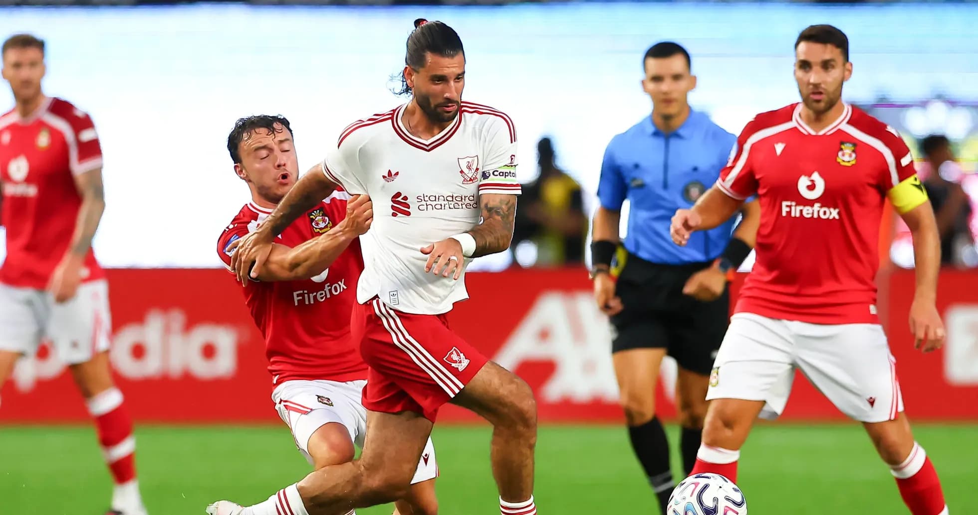 Player in white being challenged by opponent in red
