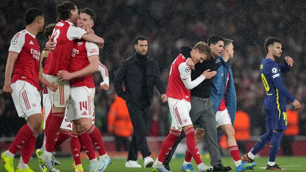 Arsenal players celebrating after UEFA Champions League match
