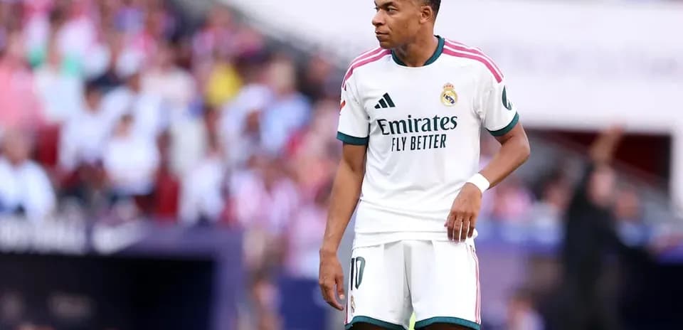 Kylian Mbappé in Real Madrid kit on the pitch