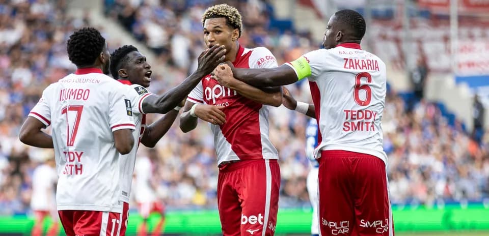 Players celebrating a goal during a match