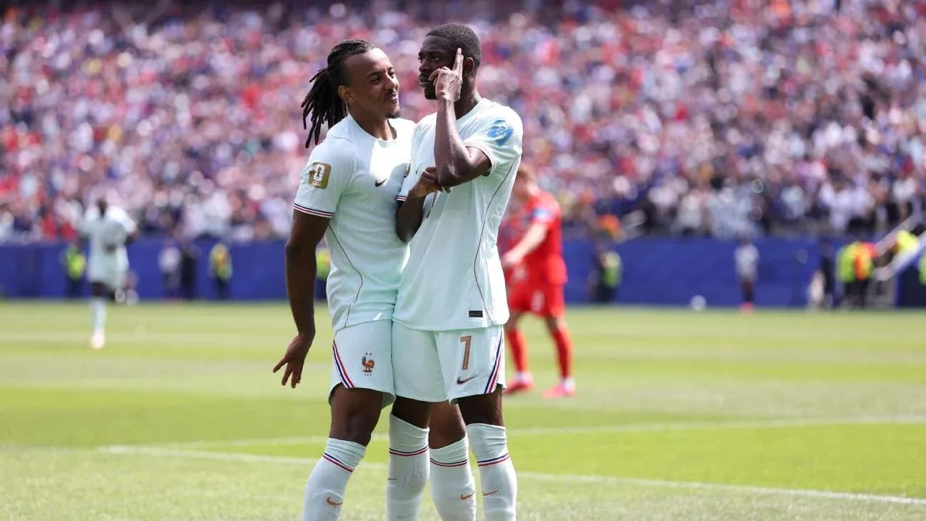 Two players celebrating a goal on the pitch