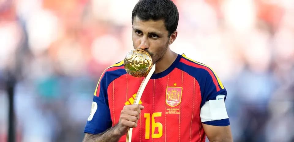 Player celebrating with trophy after match victory