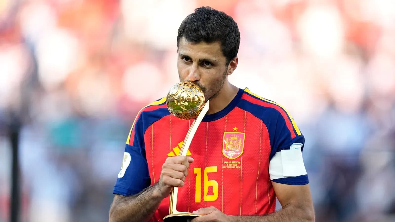 Player celebrating with trophy after match victory