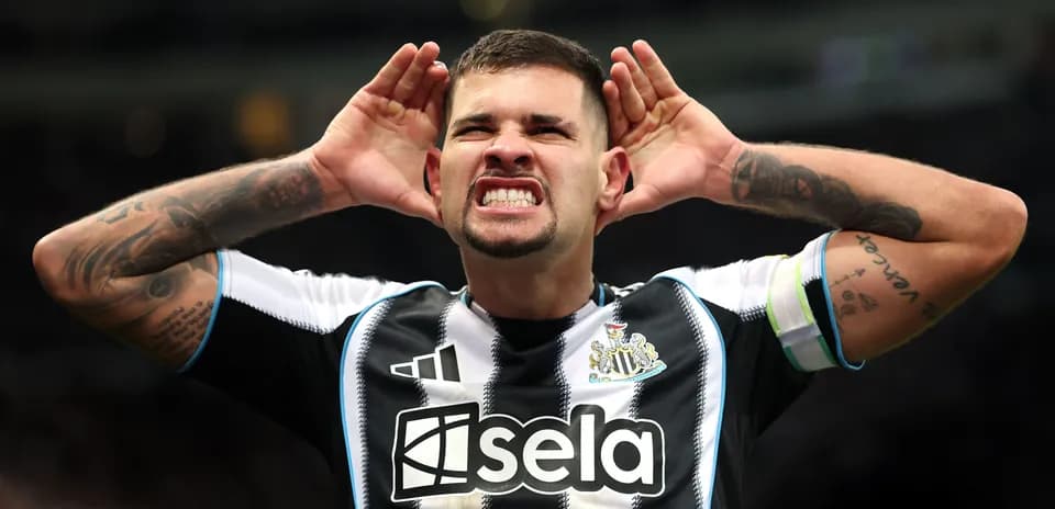 Player celebrating and gesturing to fans at stadium