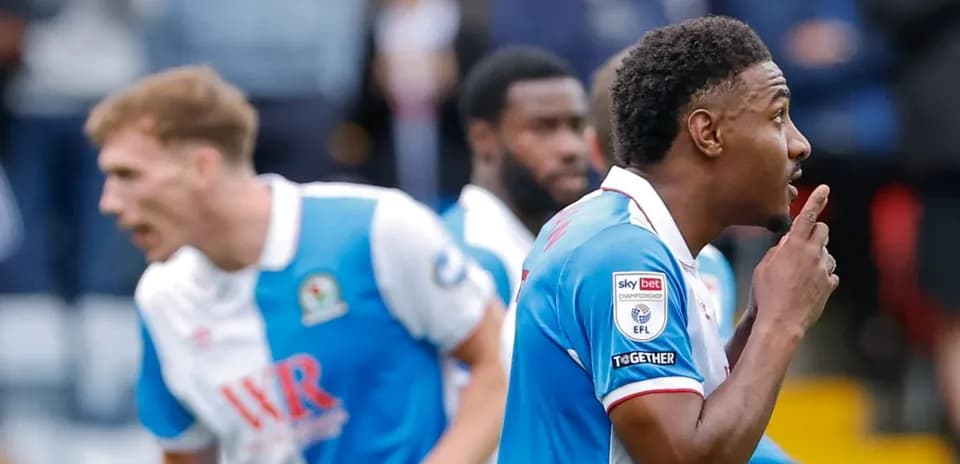 Blackburn Rovers players celebrating a goal together