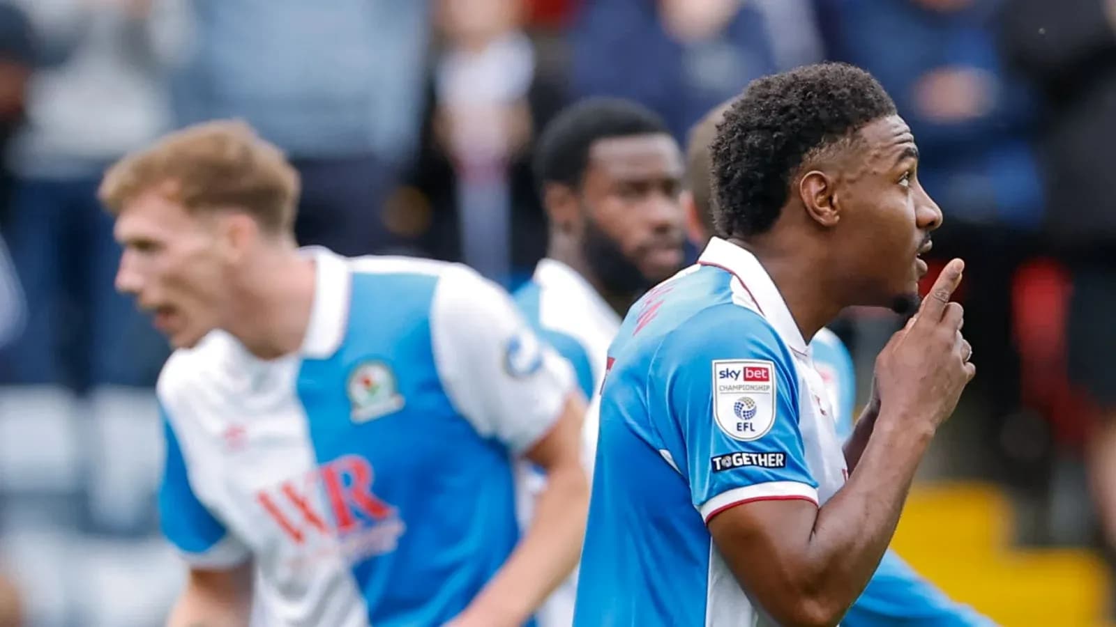 Blackburn Rovers players celebrating a goal together
