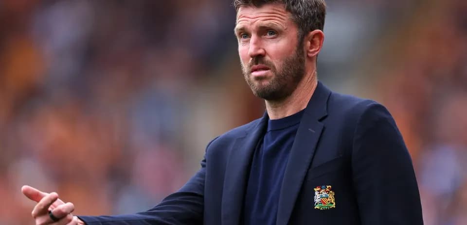 Coach gesturing during a football match