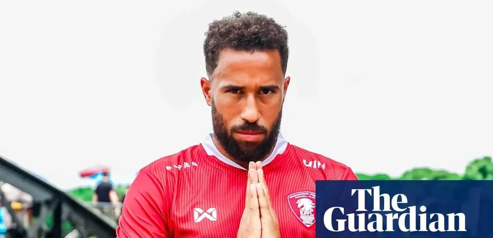 Player in red jersey with hands together in prayer