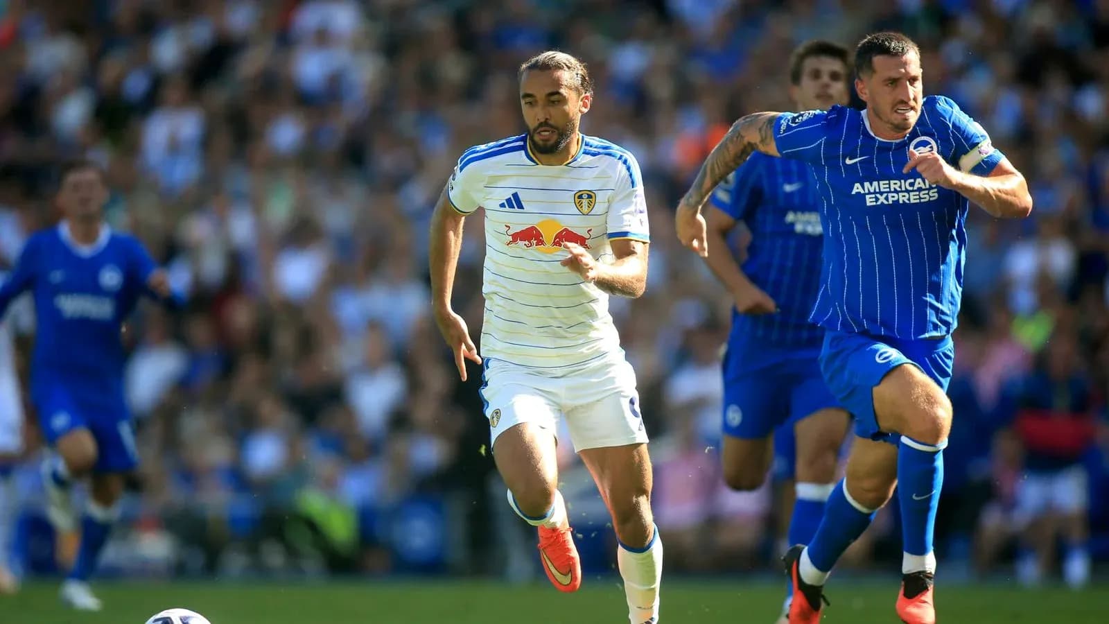 Leeds player sprinting with Brighton player in pursuit