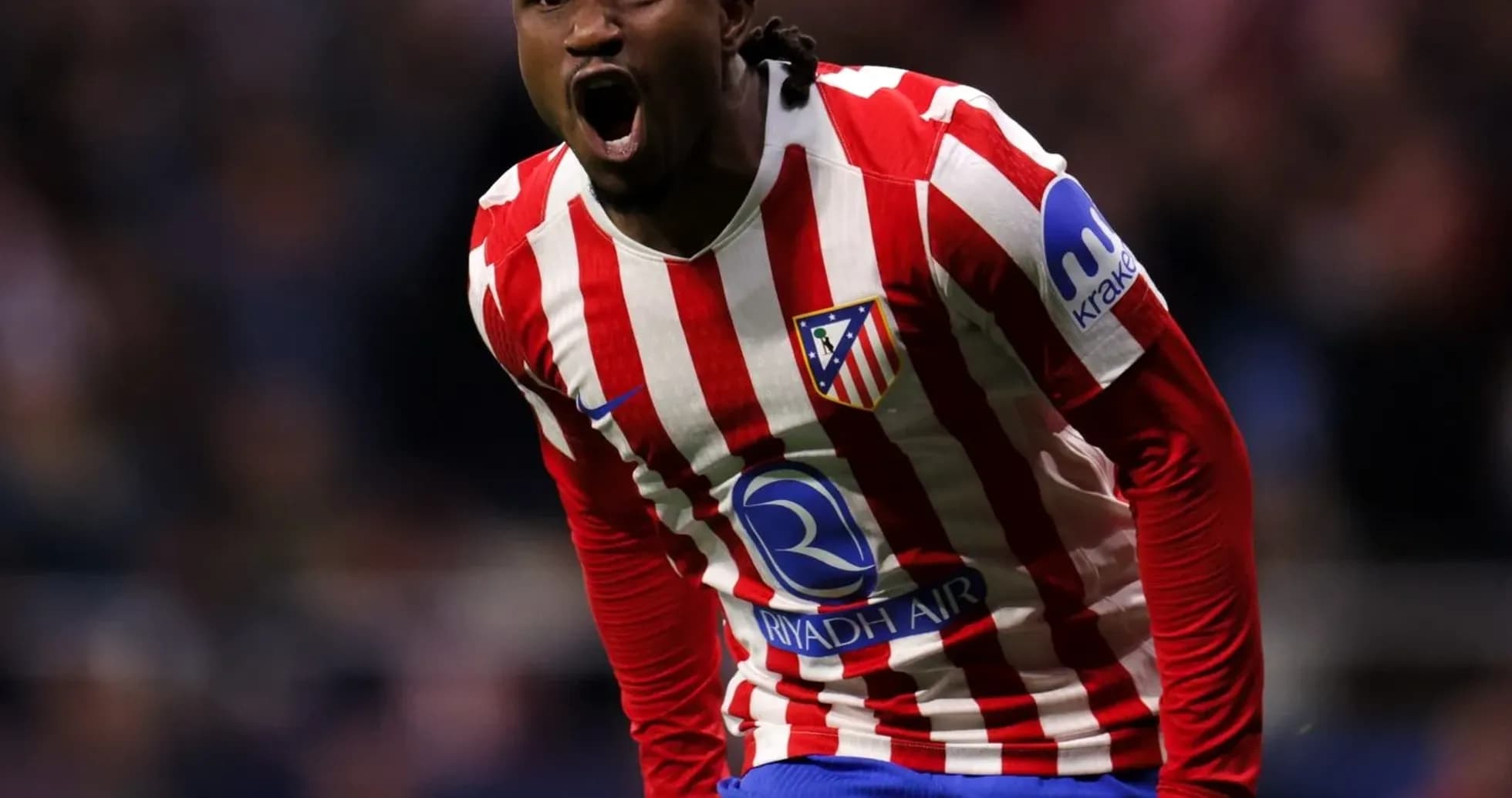 Player celebrating a goal for Atlético Madrid