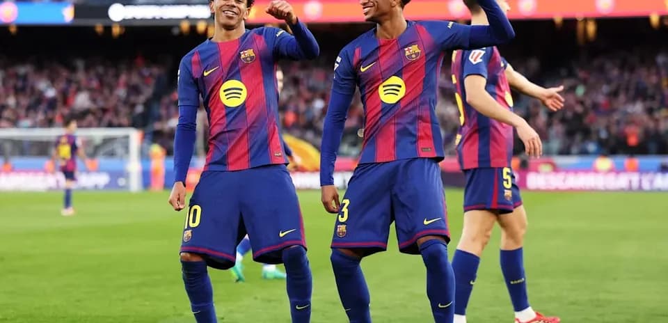 Barcelona players celebrating on the pitch