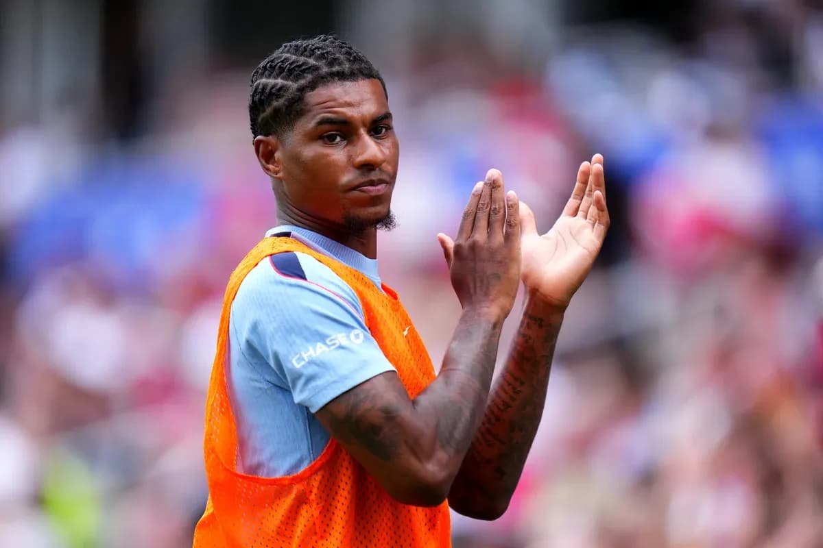 Player applauding while wearing training bib on field