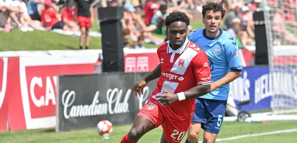 Player dribbling during HFX Wanderers vs Cavalry match