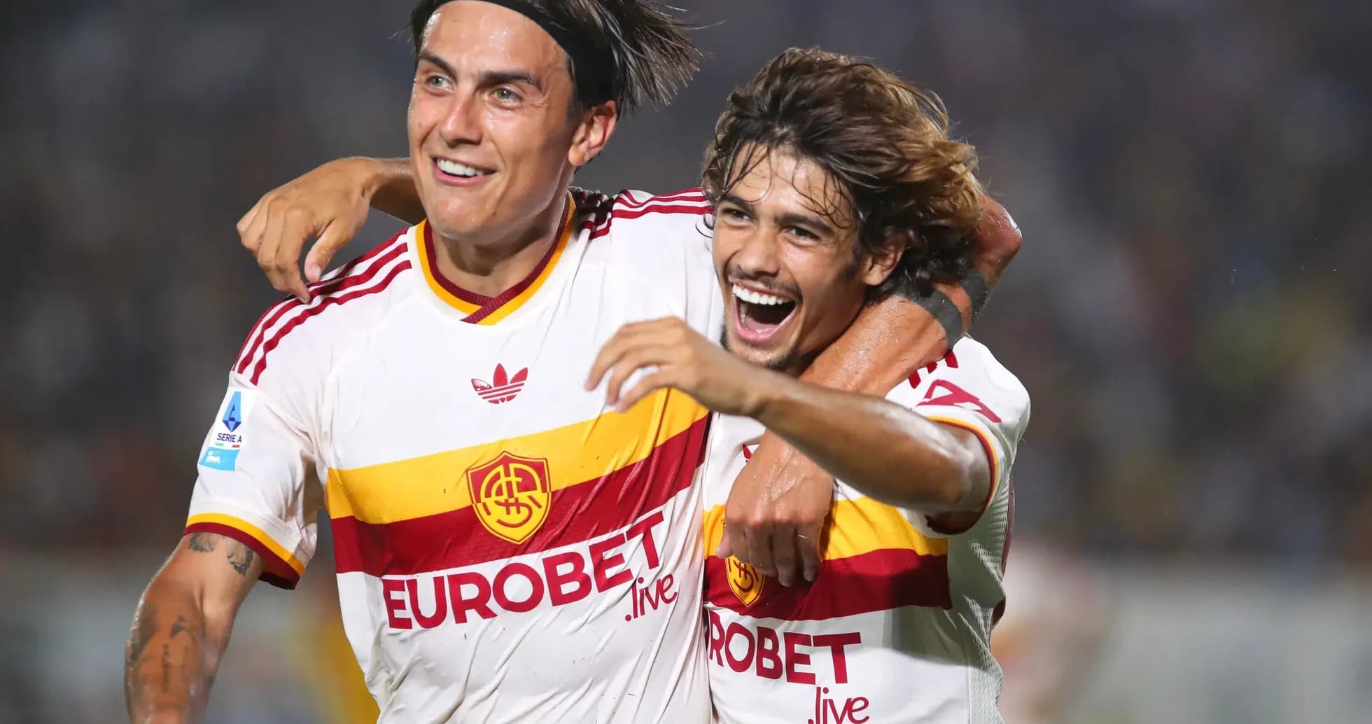 Two AS Roma players celebrating a goal