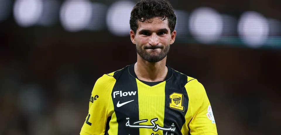 Player in yellow and black jersey on field
