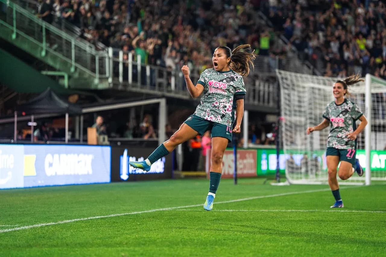 Player celebrating during Seattle Reign FC match