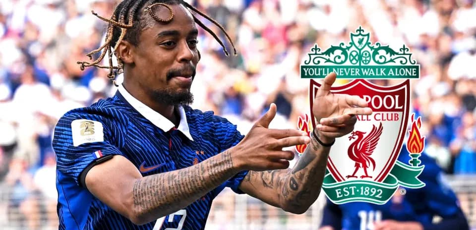 Player celebrating during a match with Liverpool logo