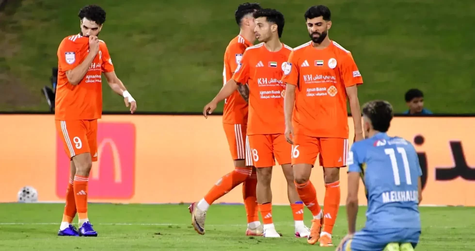 Ajman U23 players on the field during match