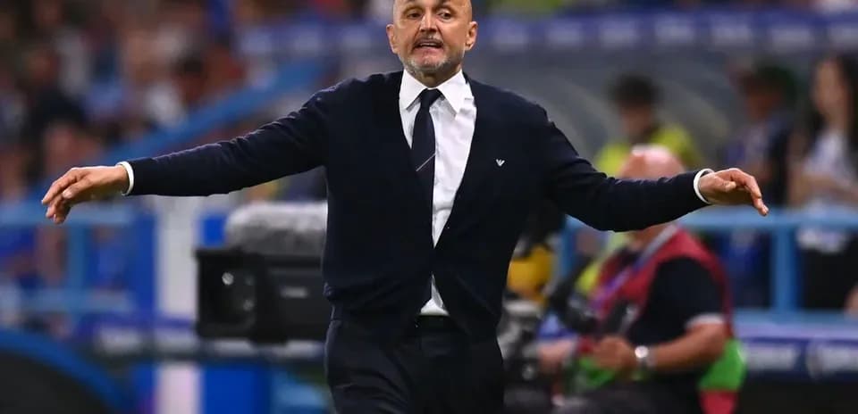 Coach gesturing on the sidelines during match