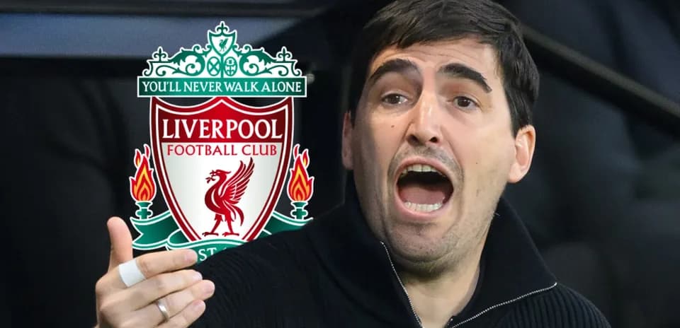 Coach gesturing during match with Liverpool logo background