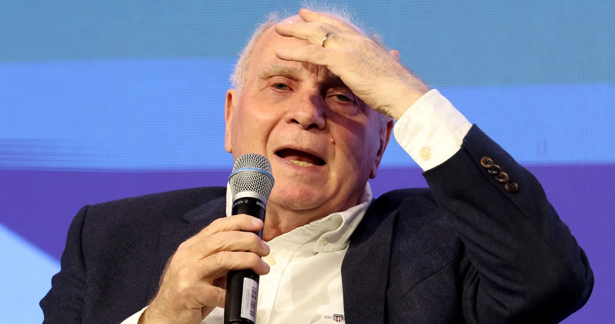 Speaker holding microphone during a discussion event