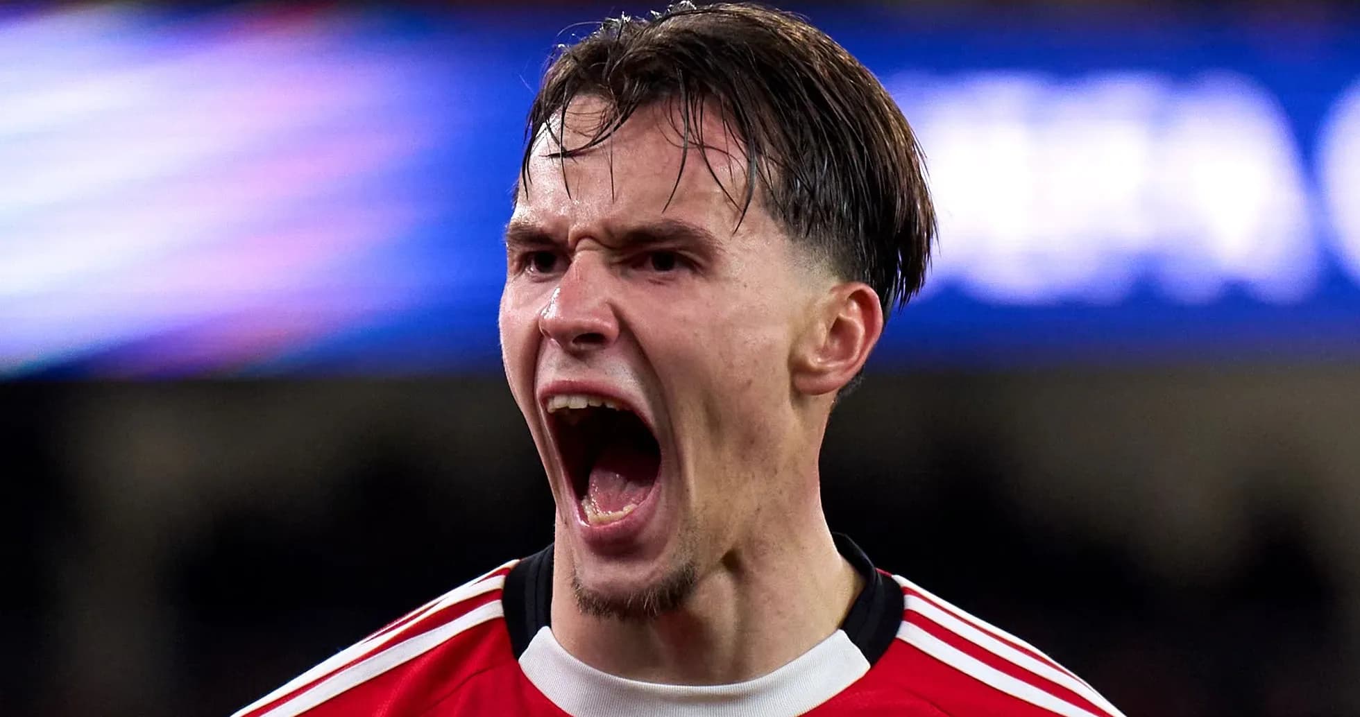 Player celebrating passionately after scoring a goal