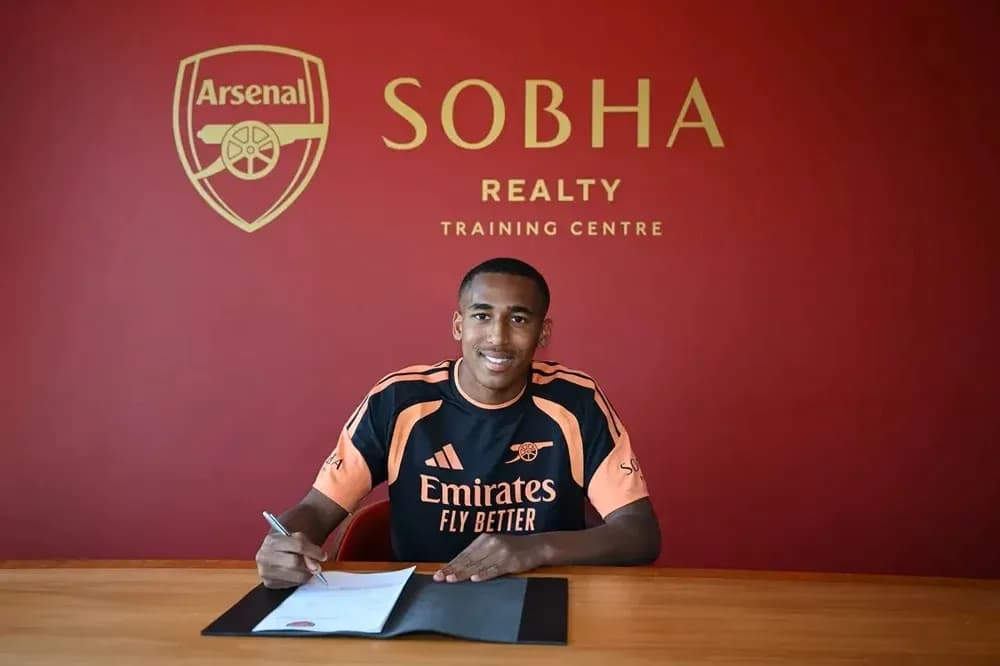 Player signing contract at Arsenal training centre