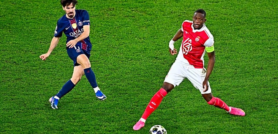 PSG player dribbling past Monaco defender