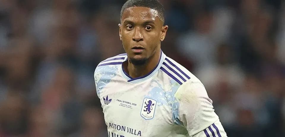 Player in Aston Villa kit during match action