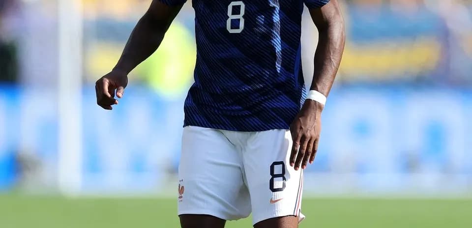 Player in France kit preparing to kick soccer ball